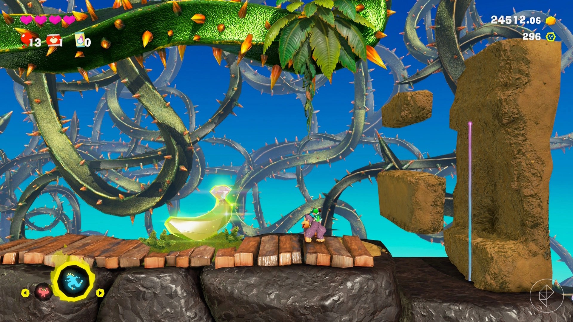DK drools by a Banandium Gem on a 2D platforming level surrounded by thorns.